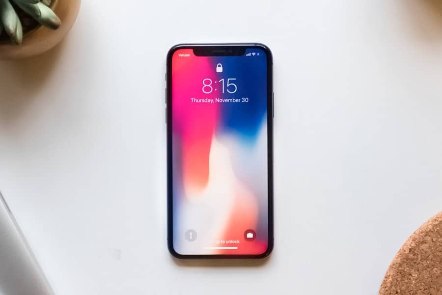 iphone on table plant lifestyle magazine unsplash photo