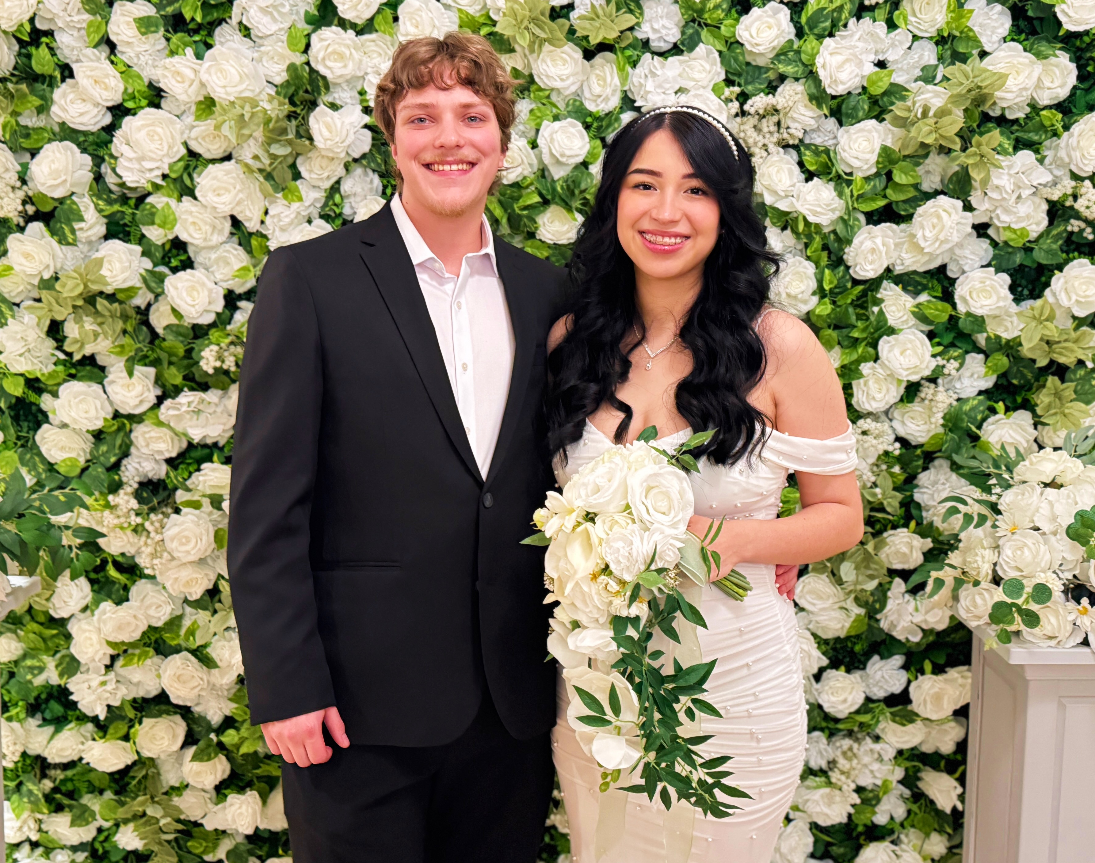 Person using a pen to cross a task off a productivity paper card.