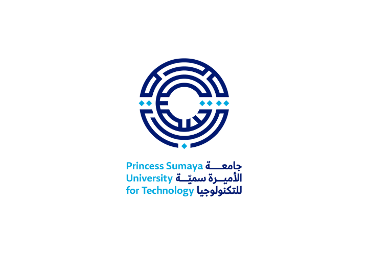 Wood table with porcelain mug, leather journal, brass pen, leather key ring, and a houseplant.