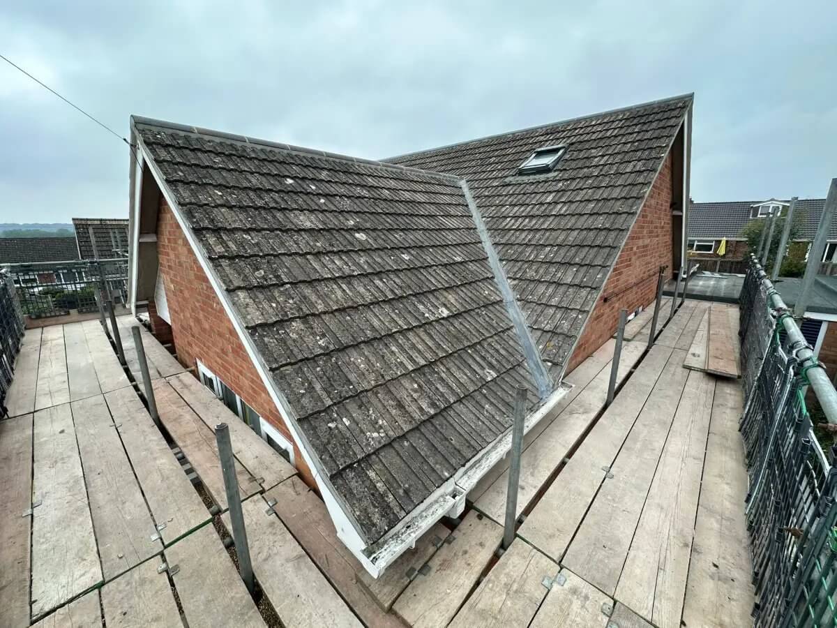 Full re-roof in progress — Roof tiling in progress with new ridge tiles
