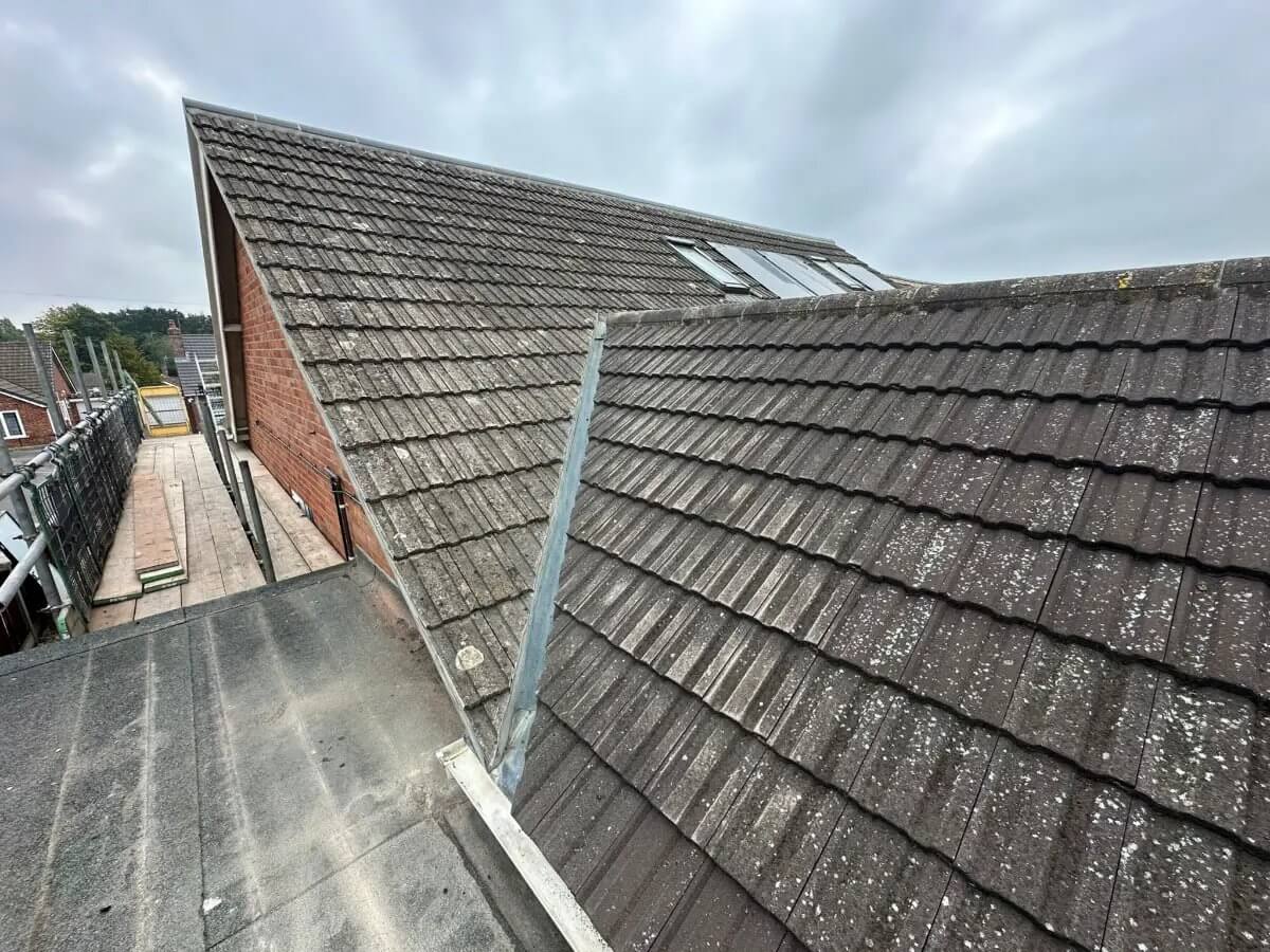 Full re-roof in progress — New concrete roof tiles with new ridge tiles