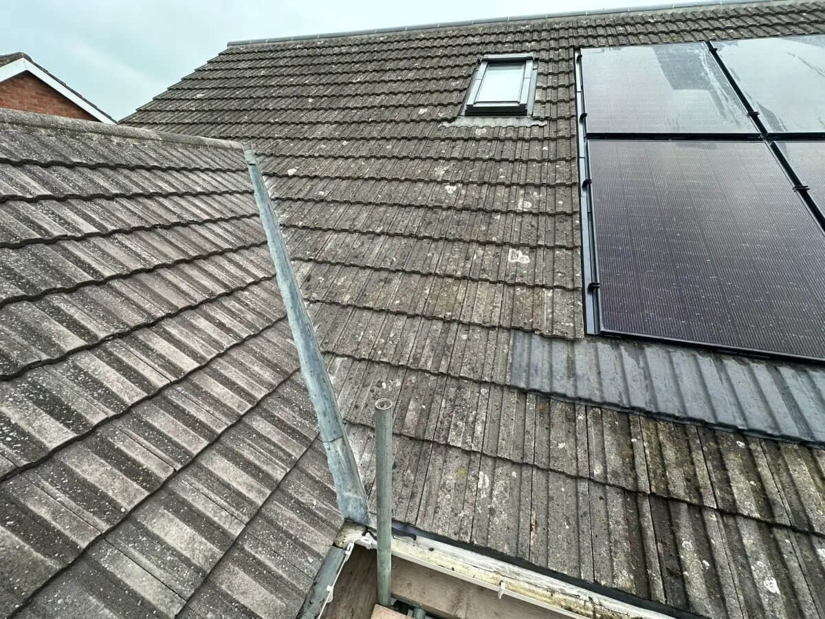 Full re-roof in progress — A freshly tiled roof slope with new ridge tiles
