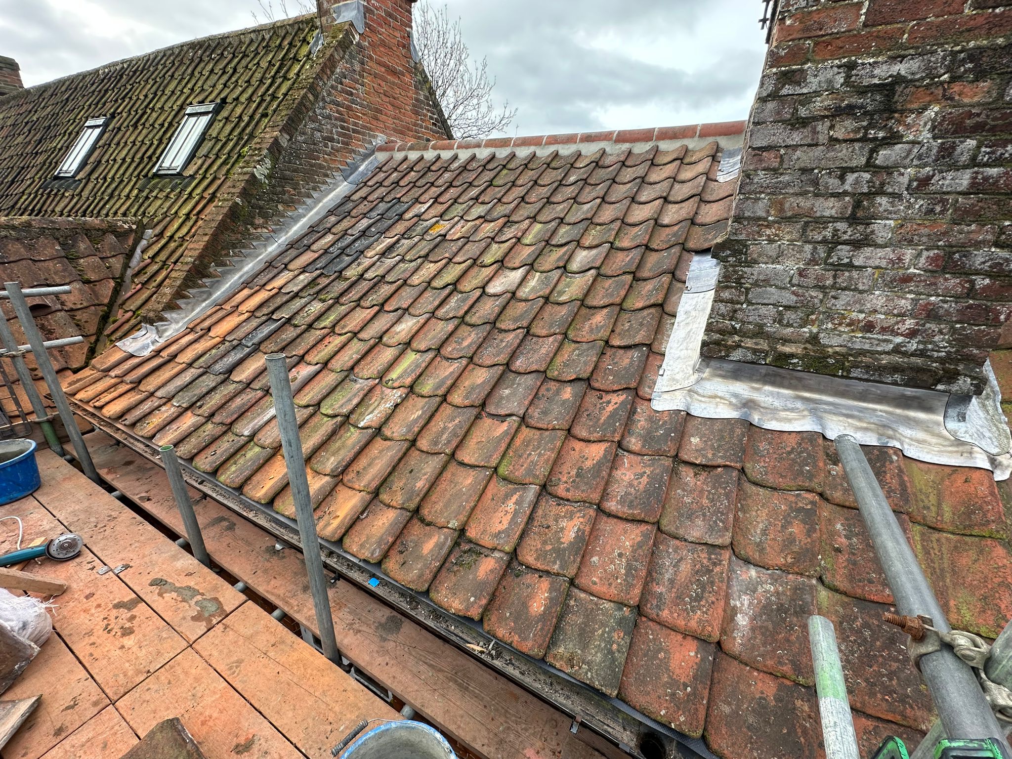 New re-roof with new back gutters on chimneys, new lead and new pots — Renewed lead roof covering to a pitched roof