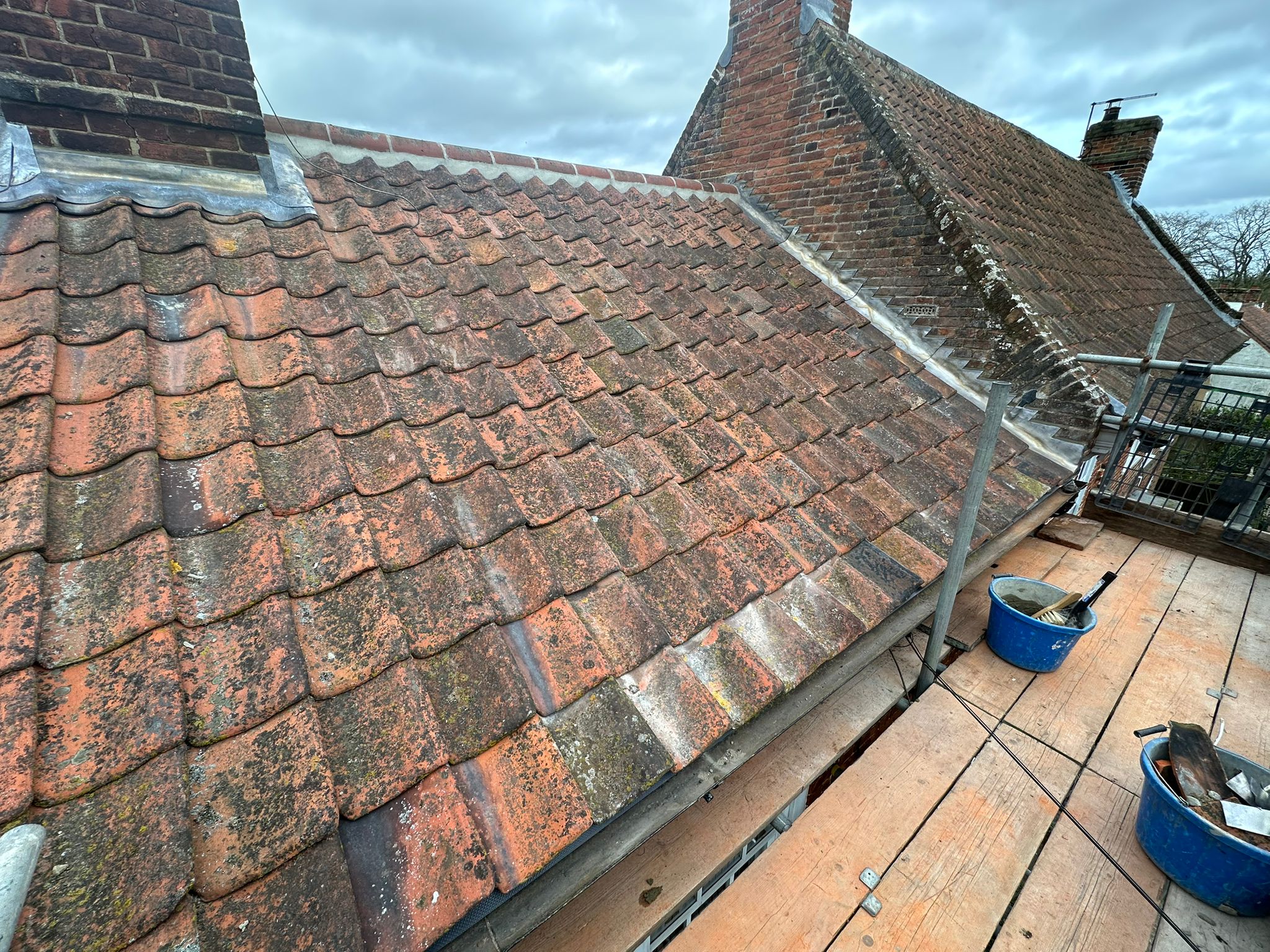 New re-roof with new back gutters on chimneys, new lead and new pots — New lead flashing on a Norwich home