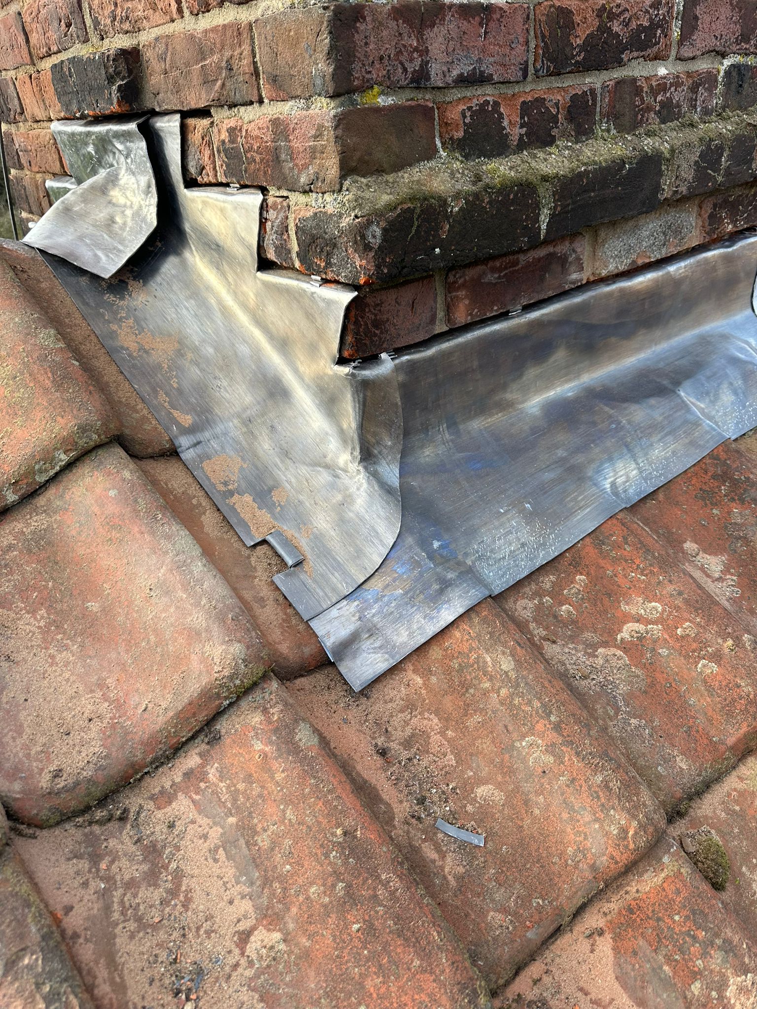 New re-roof with new back gutters on chimneys, new lead and new pots — Lead soakers and aprons to a pitched roof