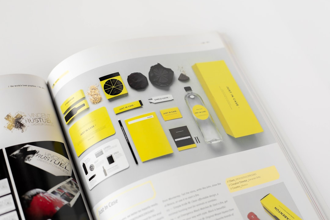 Showcase of design elements including packaging, stationery, and a bottle, all featuring a yellow theme. Bath Digital Marketing Agency