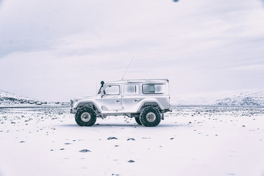 A rugged vehicle parked on a snowy landscape, showcasing its robust design. Bath Digital Marketing Agency