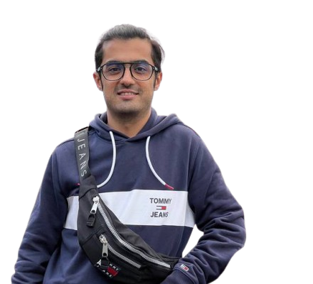 Desk with leather desk pad, walnut desk organizer, wireless keyboard and mouse, and porcelain mug.