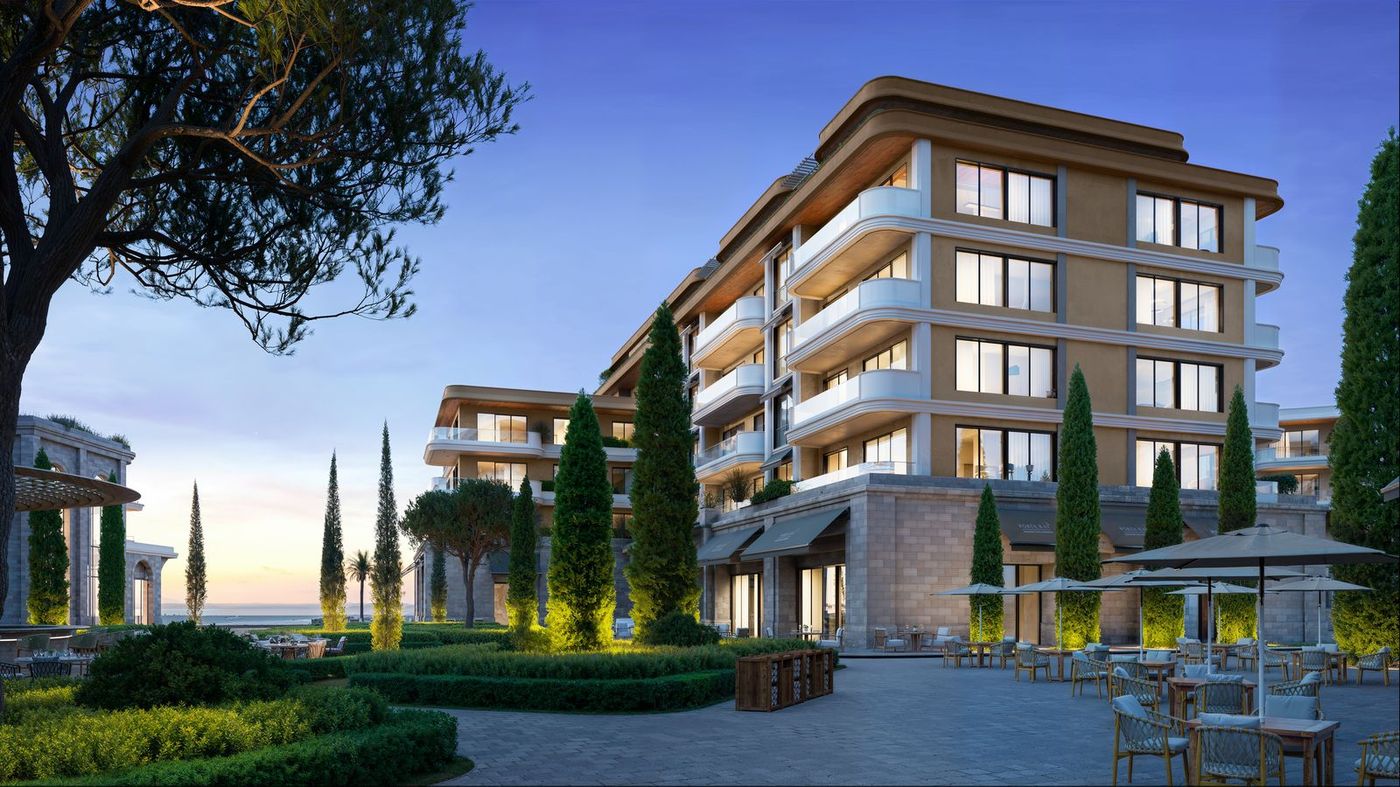 Evening rendering of a beachfront condo-hotel building with landscaped gardens on Velika Plaža, Ulcinj