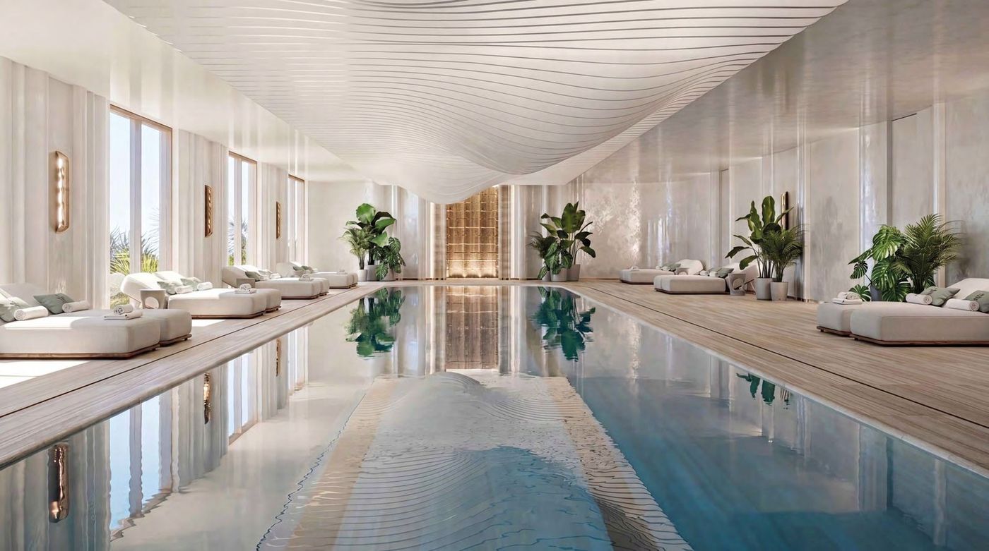 Rendering of a bright indoor pool with loungers and tall windows at a new-build residence in Budva