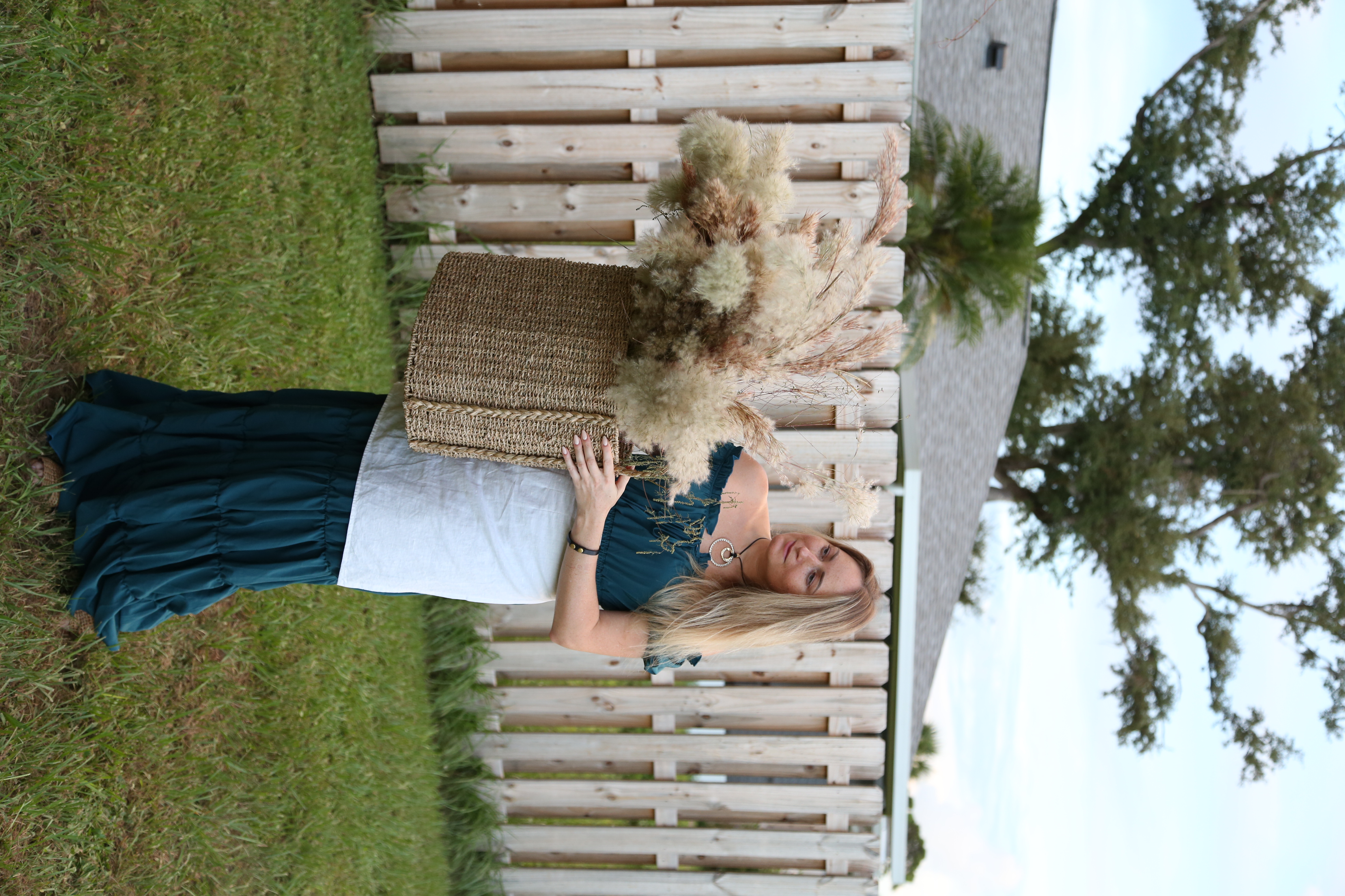 Olive drab green insulated bottle with flared screw lid and flat top.