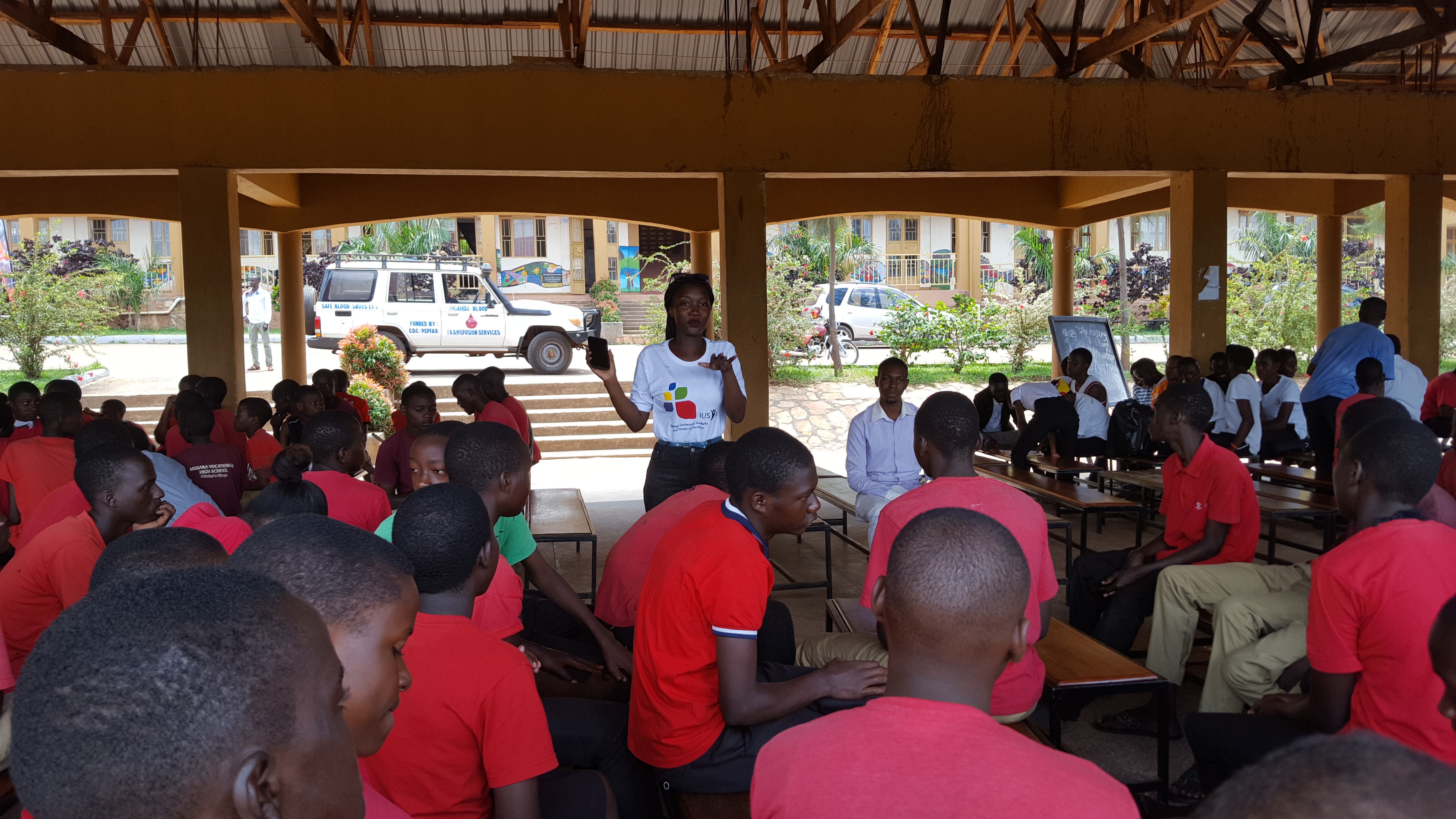 Two each of gray, white, and black shirts laying flat.