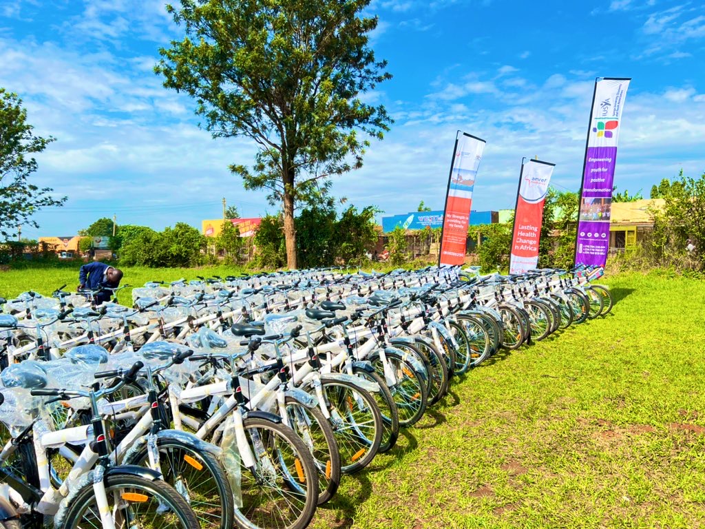 Hand holding black machined steel mechanical pencil with brass tip and top.