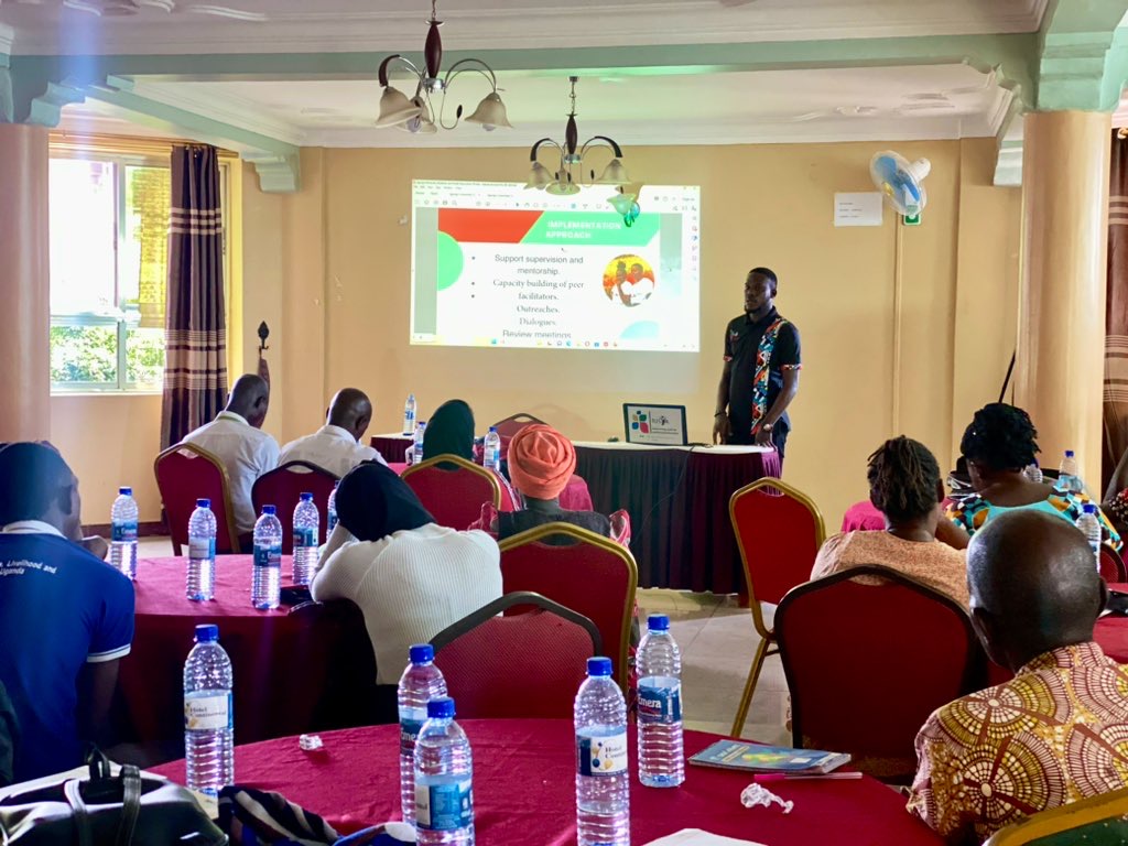 Person using a pen to cross a task off a productivity paper card.