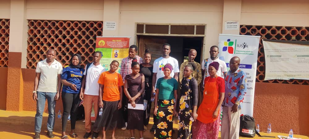 Hand holding black machined steel mechanical pencil with brass tip and top.