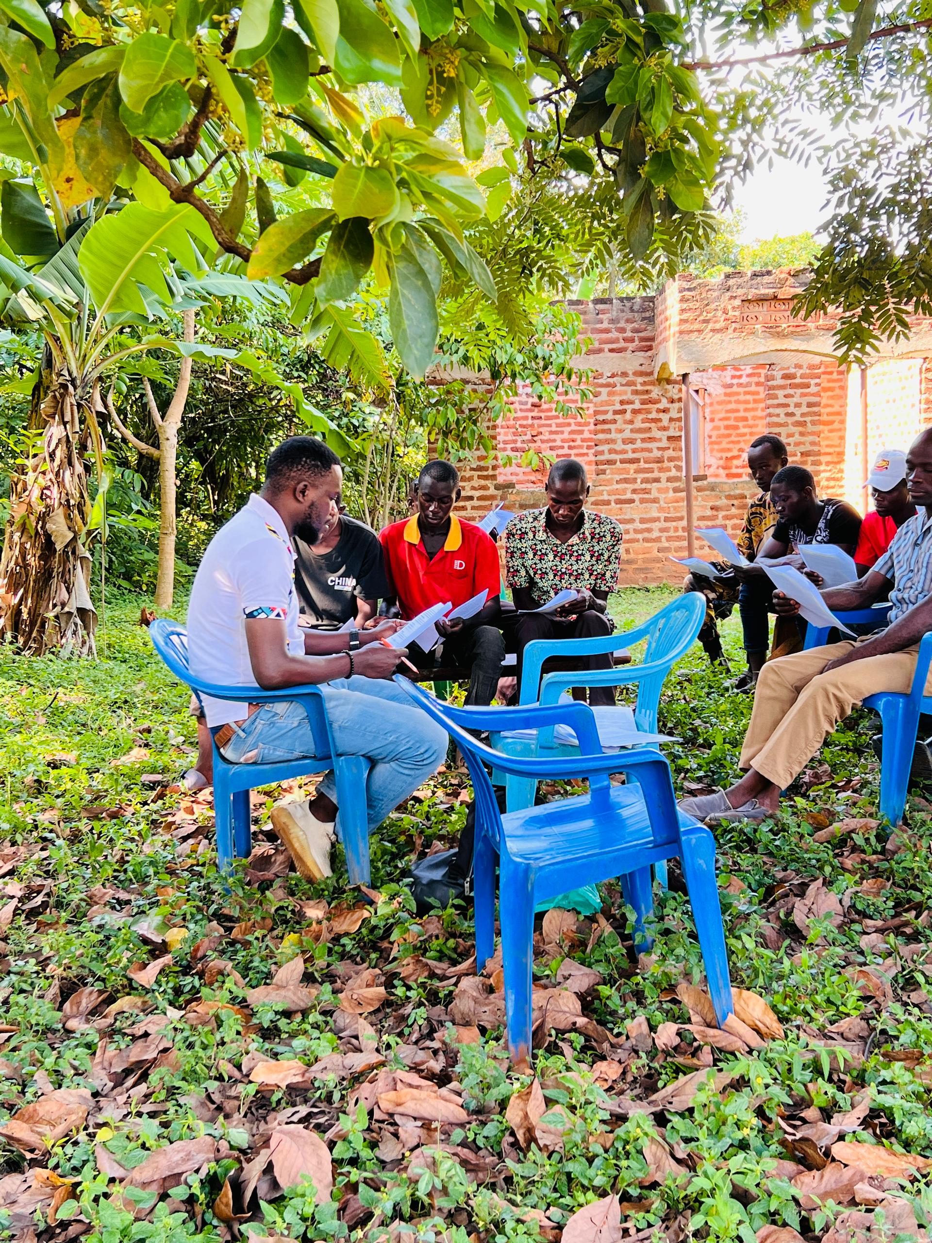 Hand holding black machined steel mechanical pencil with brass tip and top.