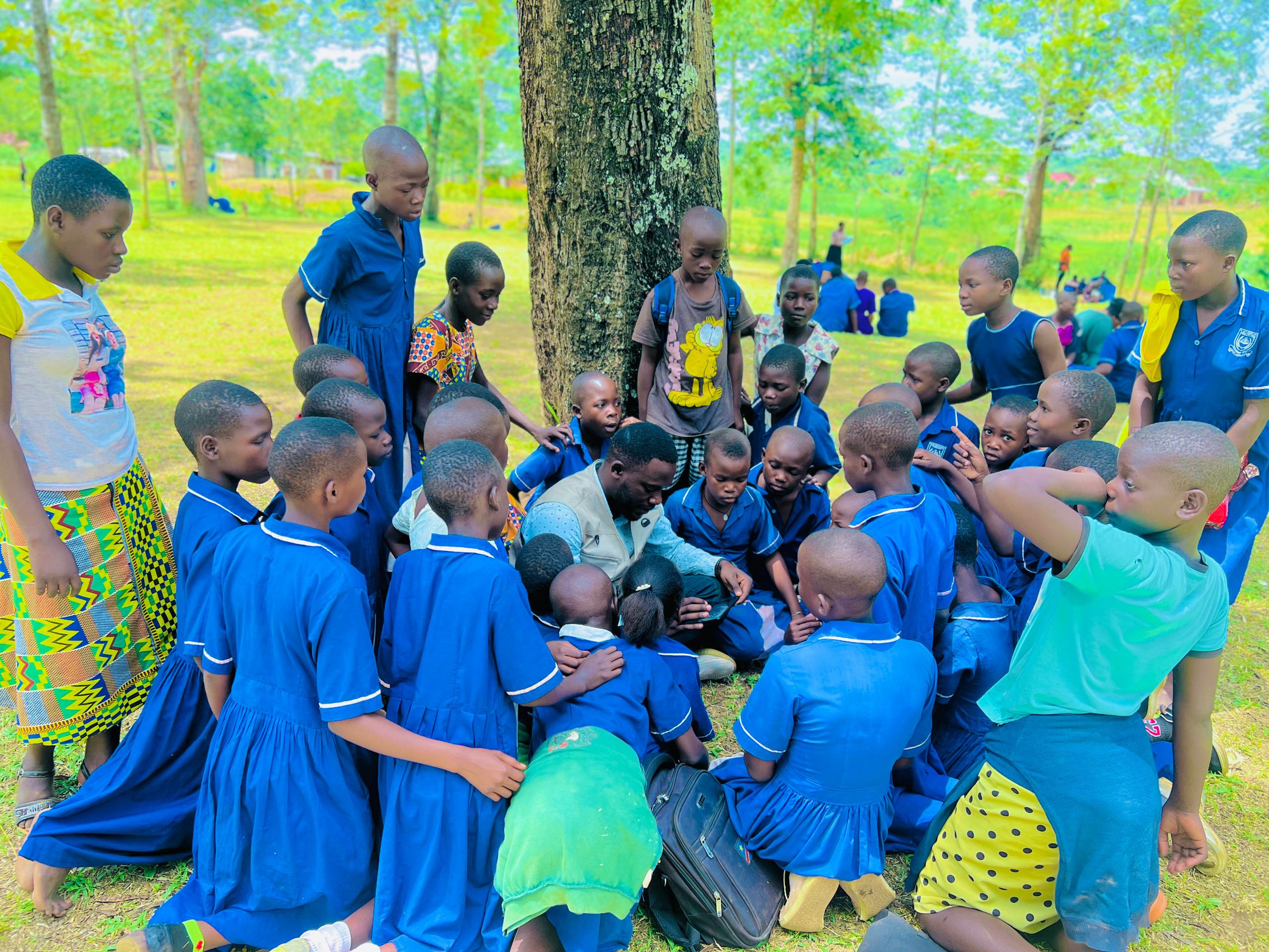 Hand holding black machined steel mechanical pencil with brass tip and top.