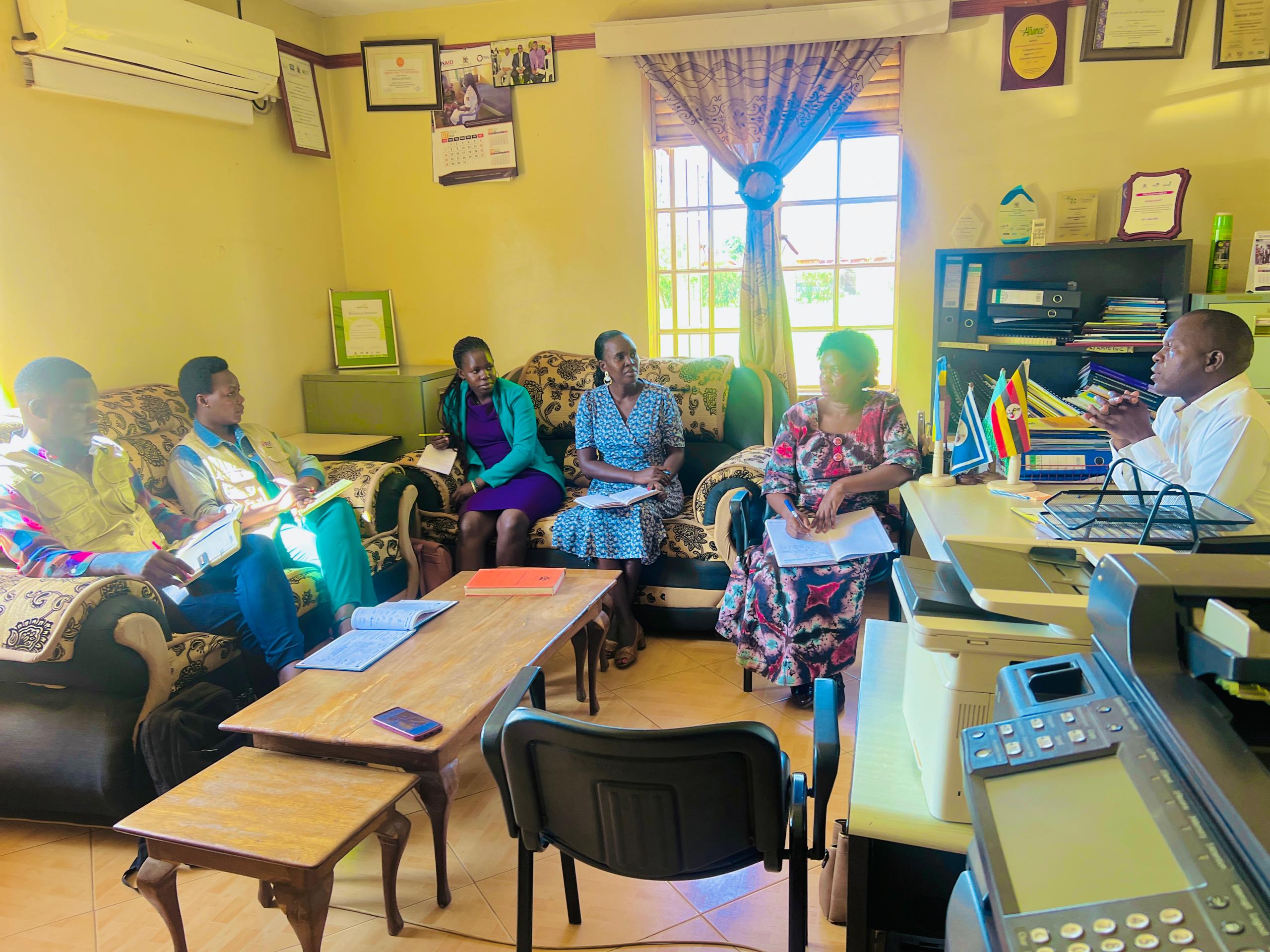 Person using a pen to cross a task off a productivity paper card.