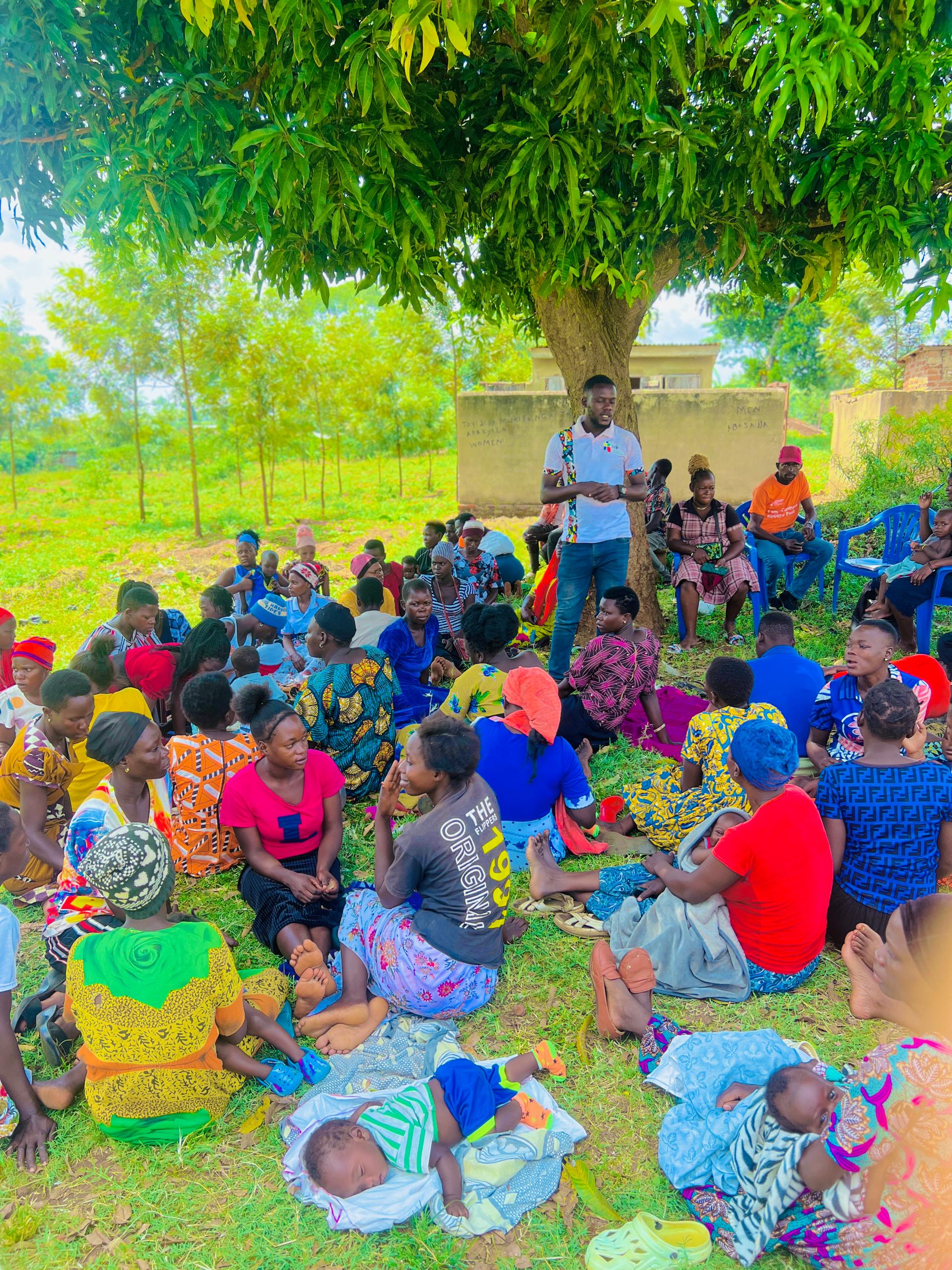 Hand holding black machined steel mechanical pencil with brass tip and top.