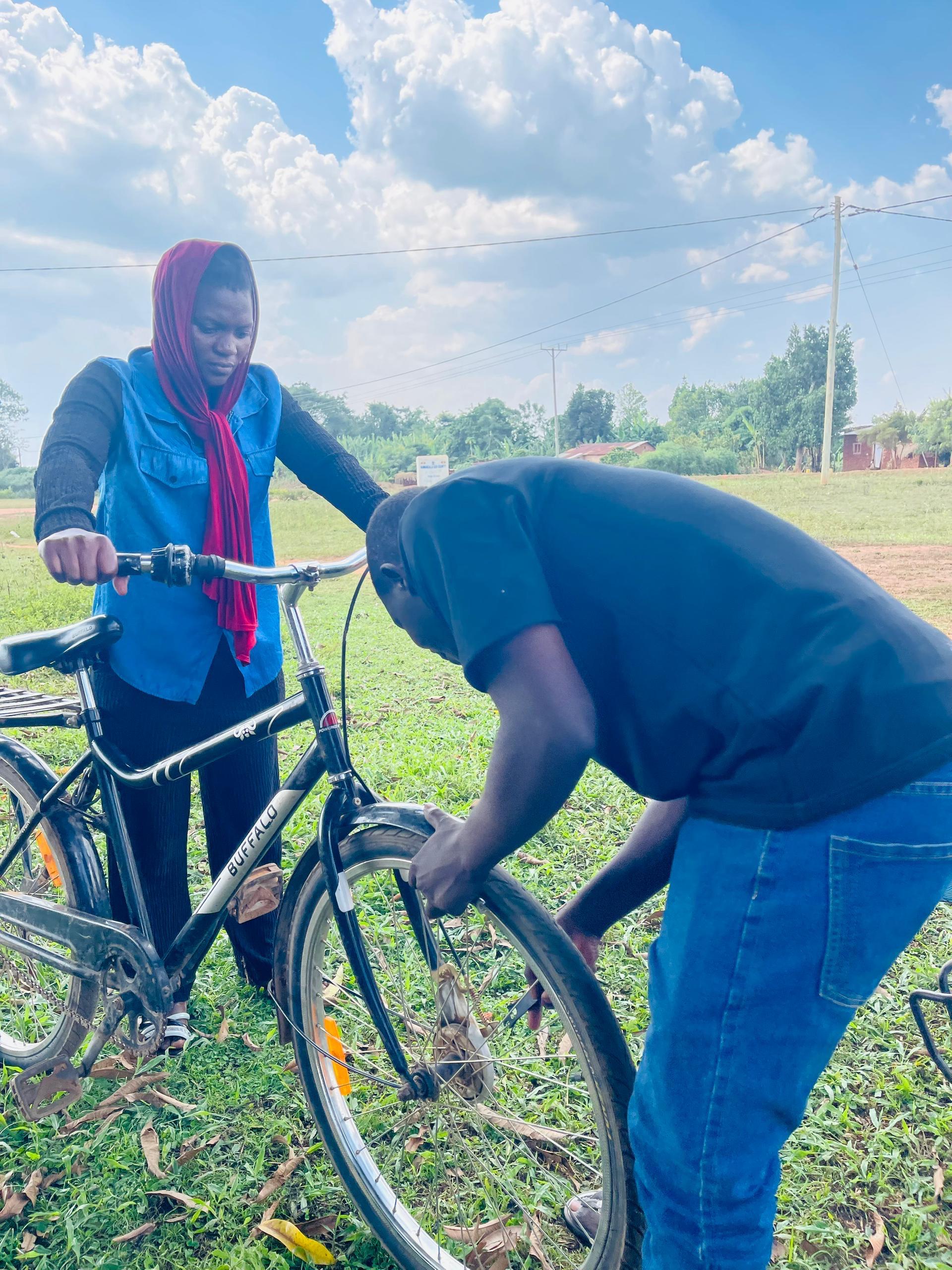 Hand holding black machined steel mechanical pencil with brass tip and top.