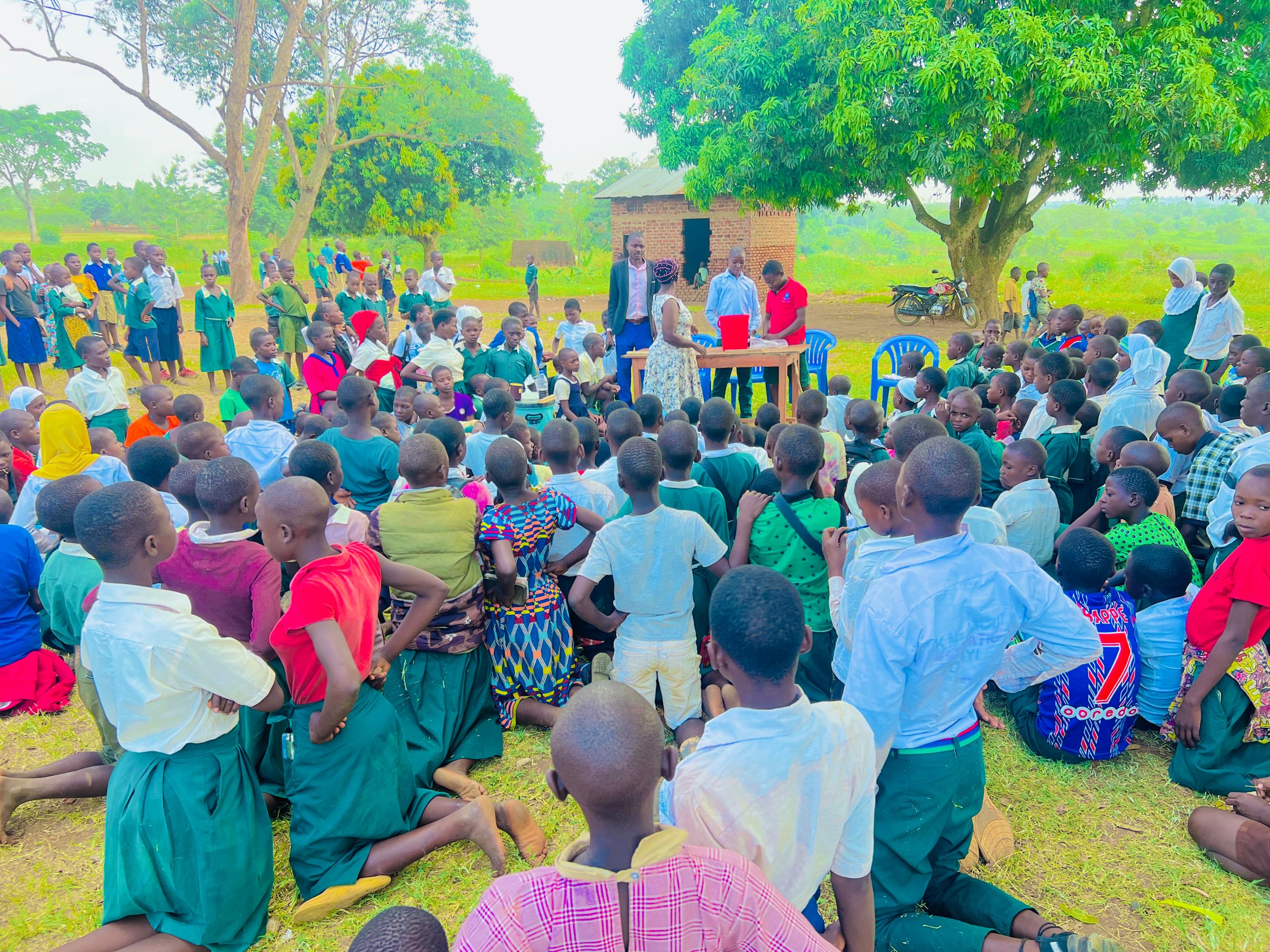 Hand holding black machined steel mechanical pencil with brass tip and top.