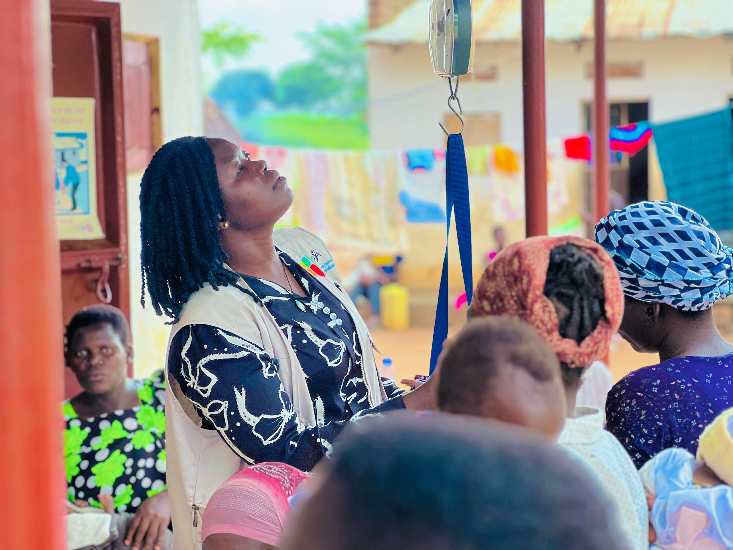 Person using a pen to cross a task off a productivity paper card.