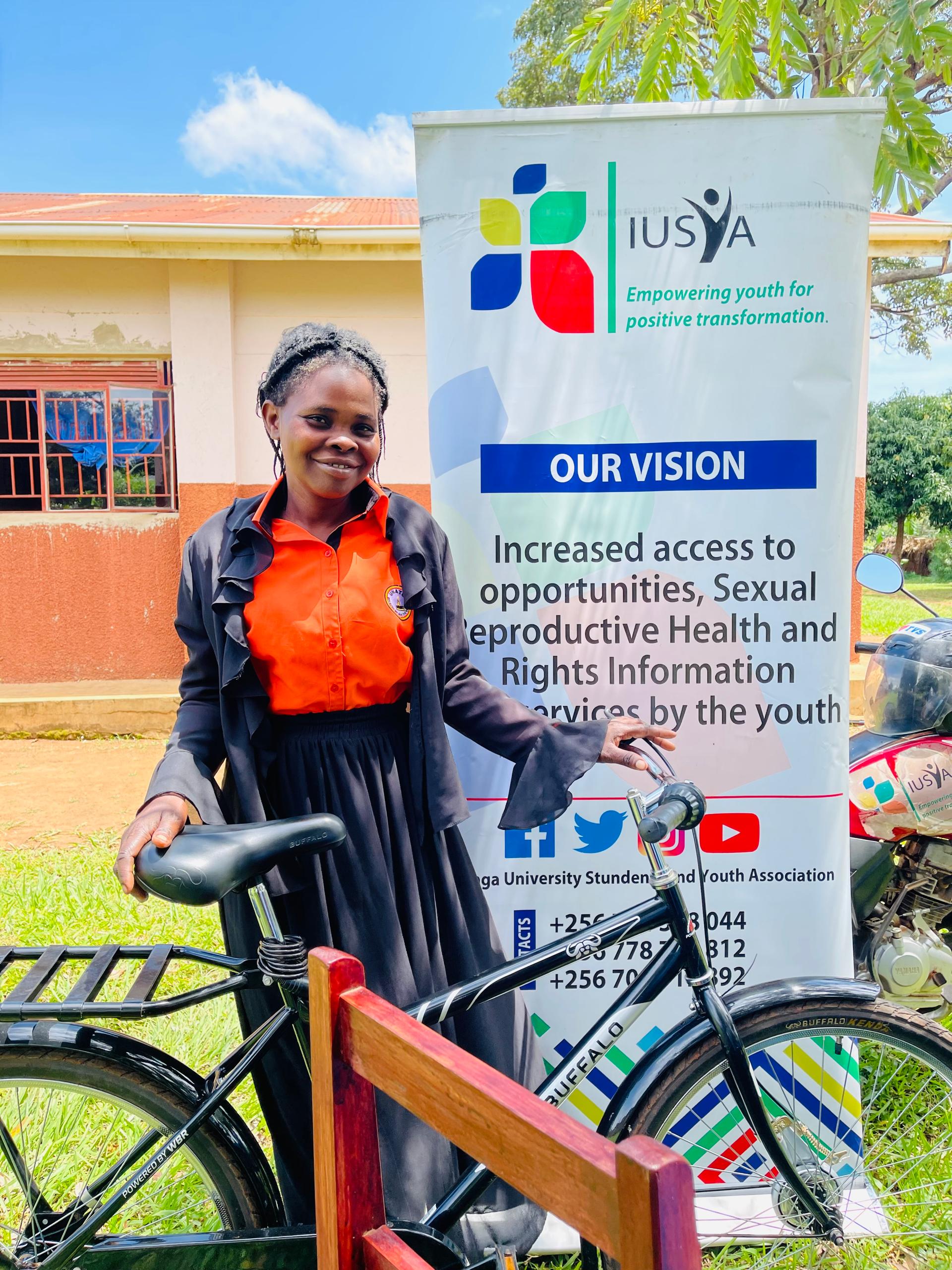 Hand holding black machined steel mechanical pencil with brass tip and top.