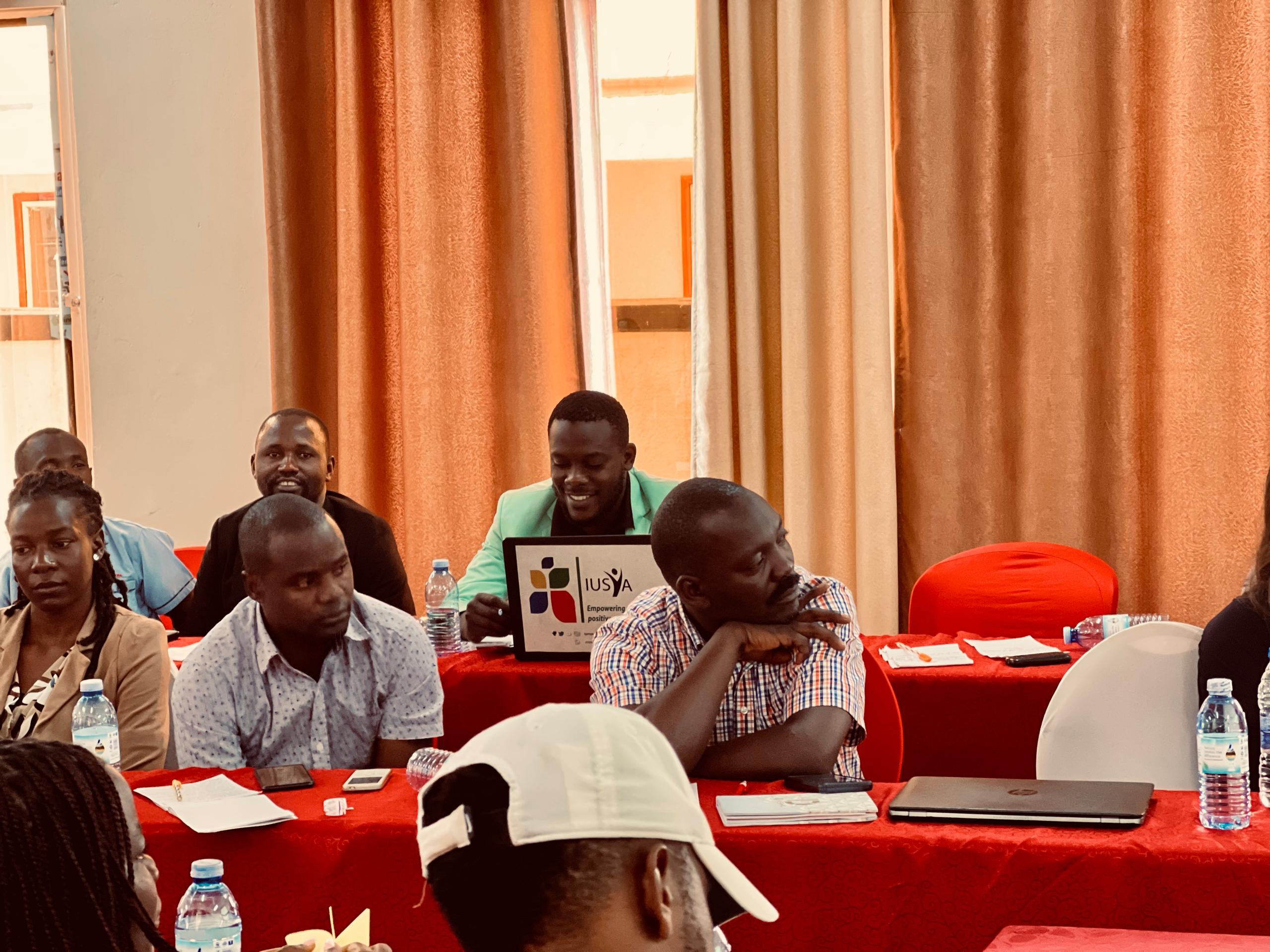 Tall slender porcelain bottle with natural clay textured body and cork stopper.