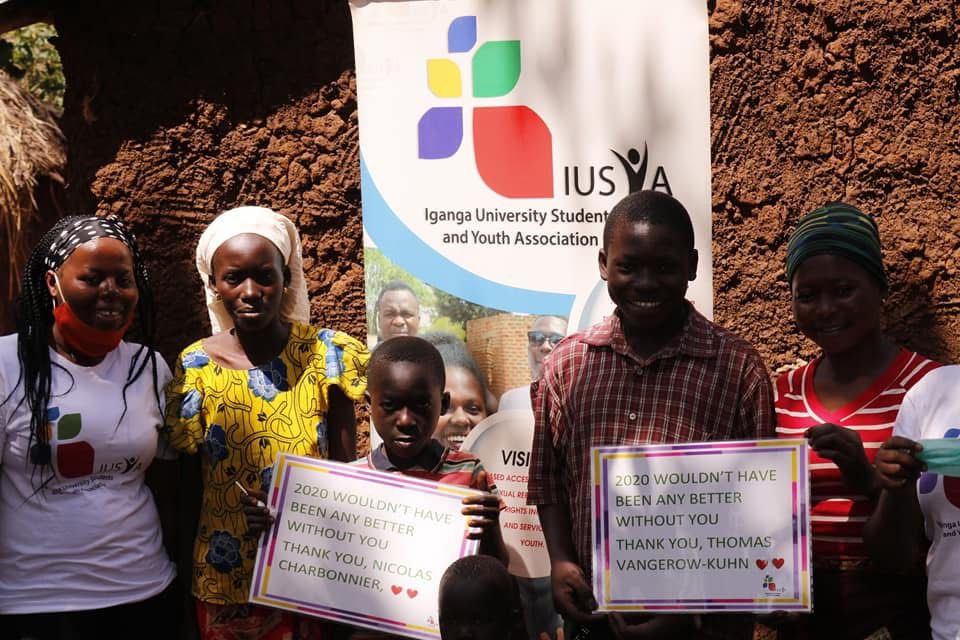 Person using a pen to cross a task off a productivity paper card.