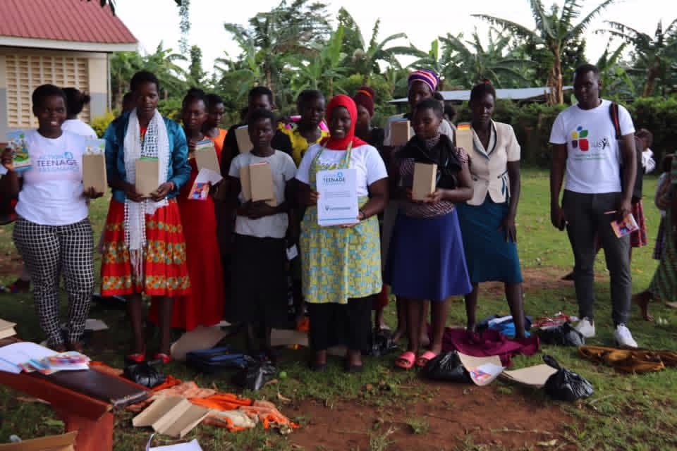 Two each of gray, white, and black shirts laying flat.