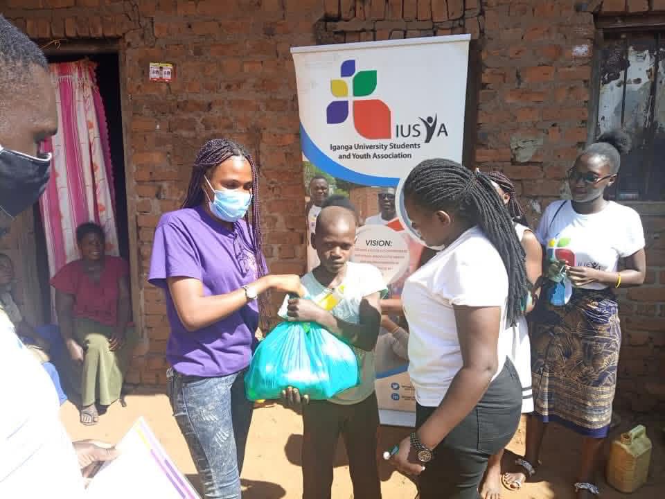 Hand holding black machined steel mechanical pencil with brass tip and top.