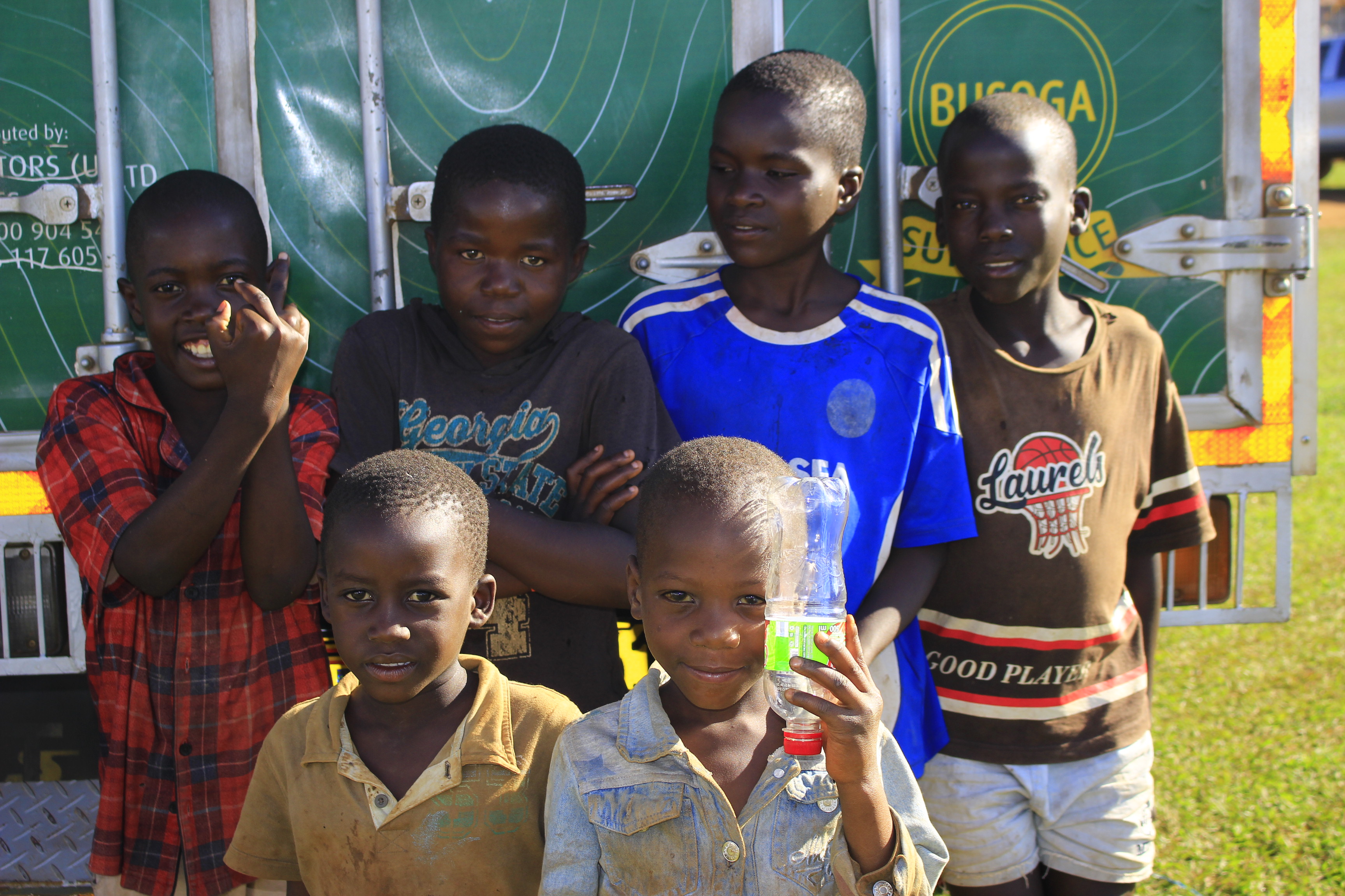 Person using a pen to cross a task off a productivity paper card.