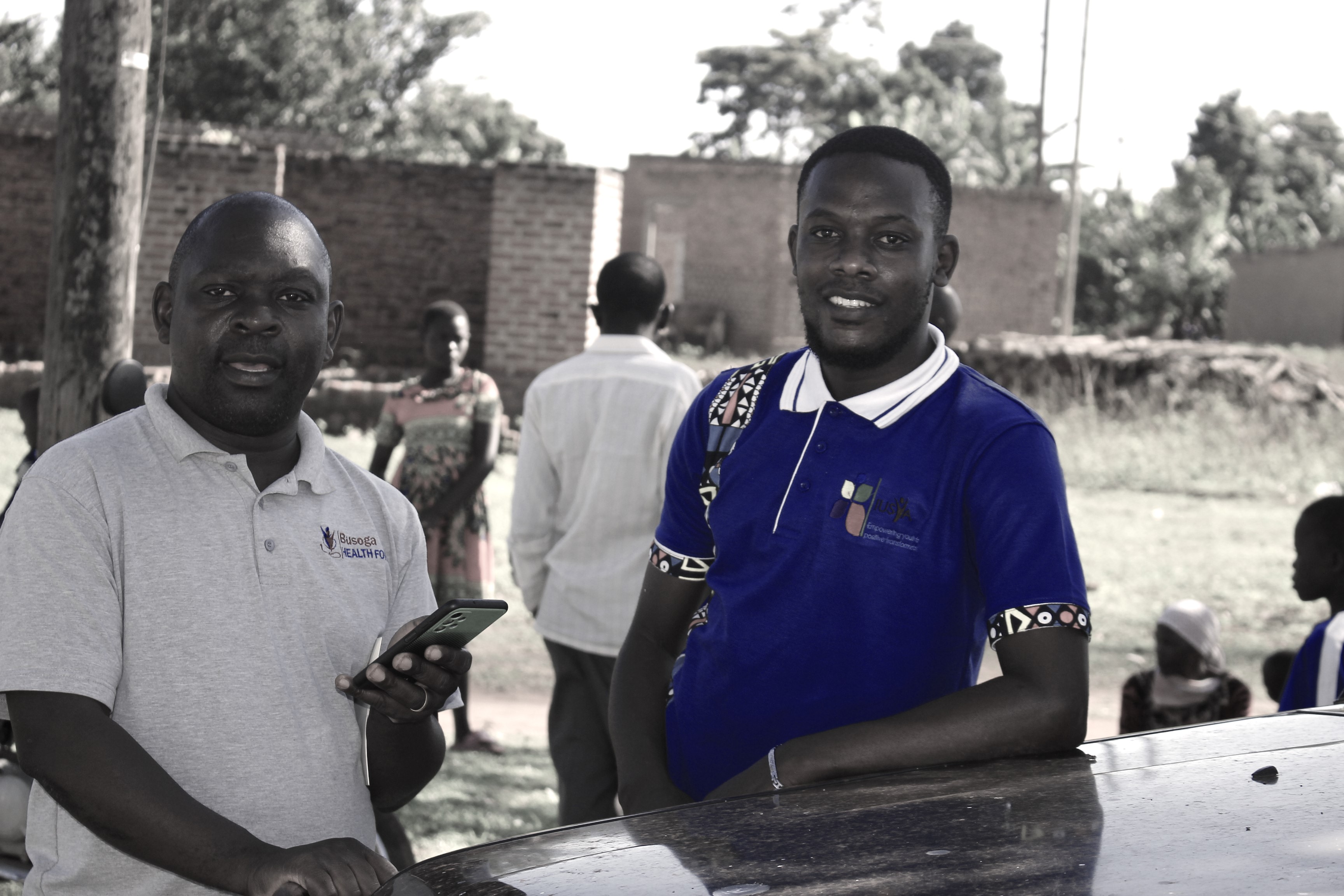 Hand holding black machined steel mechanical pencil with brass tip and top.