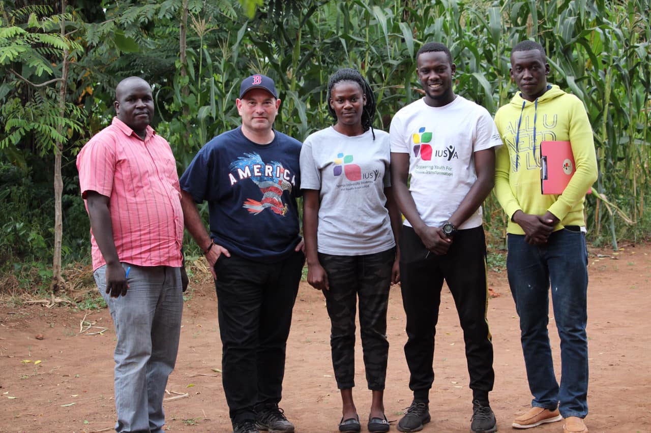 Person using a pen to cross a task off a productivity paper card.