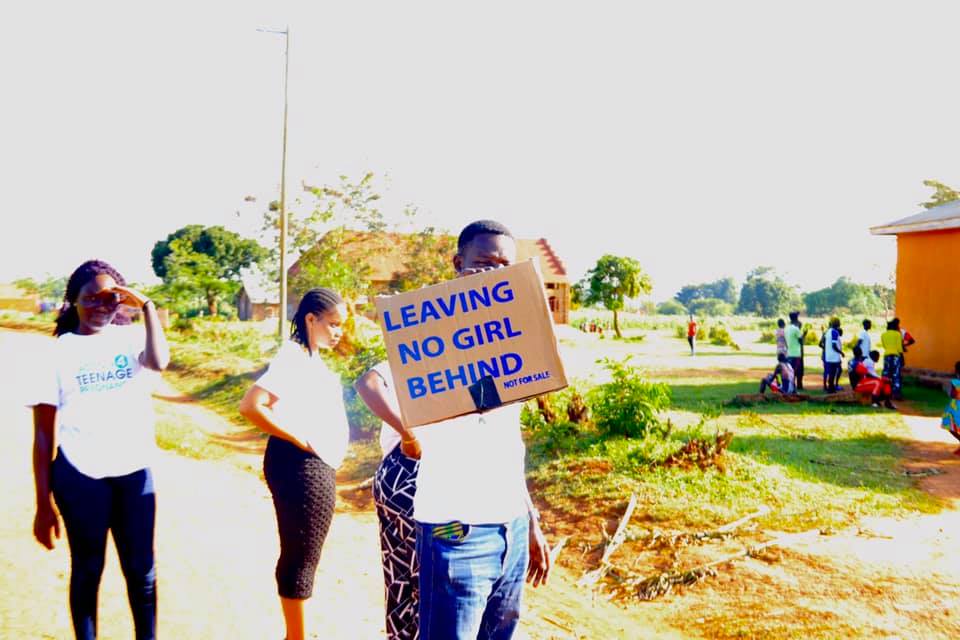 Tall slender porcelain bottle with natural clay textured body and cork stopper.