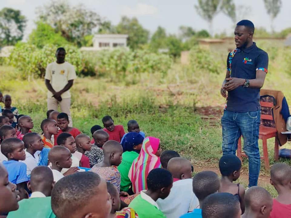 Person using a pen to cross a task off a productivity paper card.