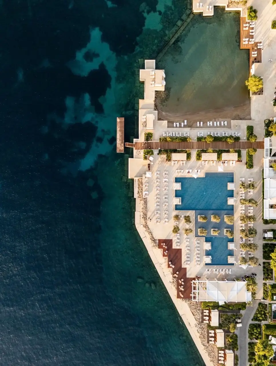 Aerial view of Four Seasons Astir Palace Athens with pool and Aegean Sea coastline