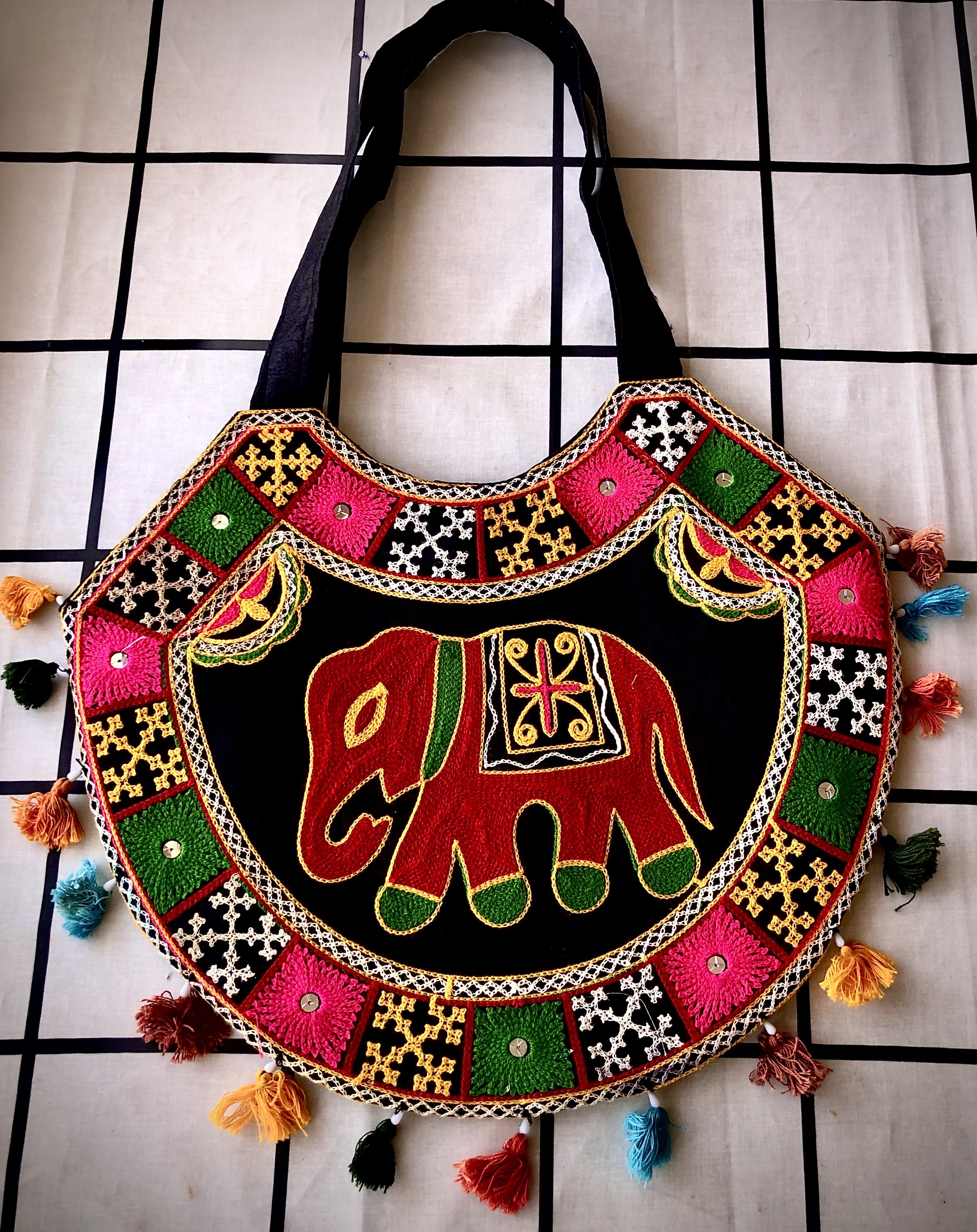 Olive drab green insulated bottle with flared screw lid and flat top.