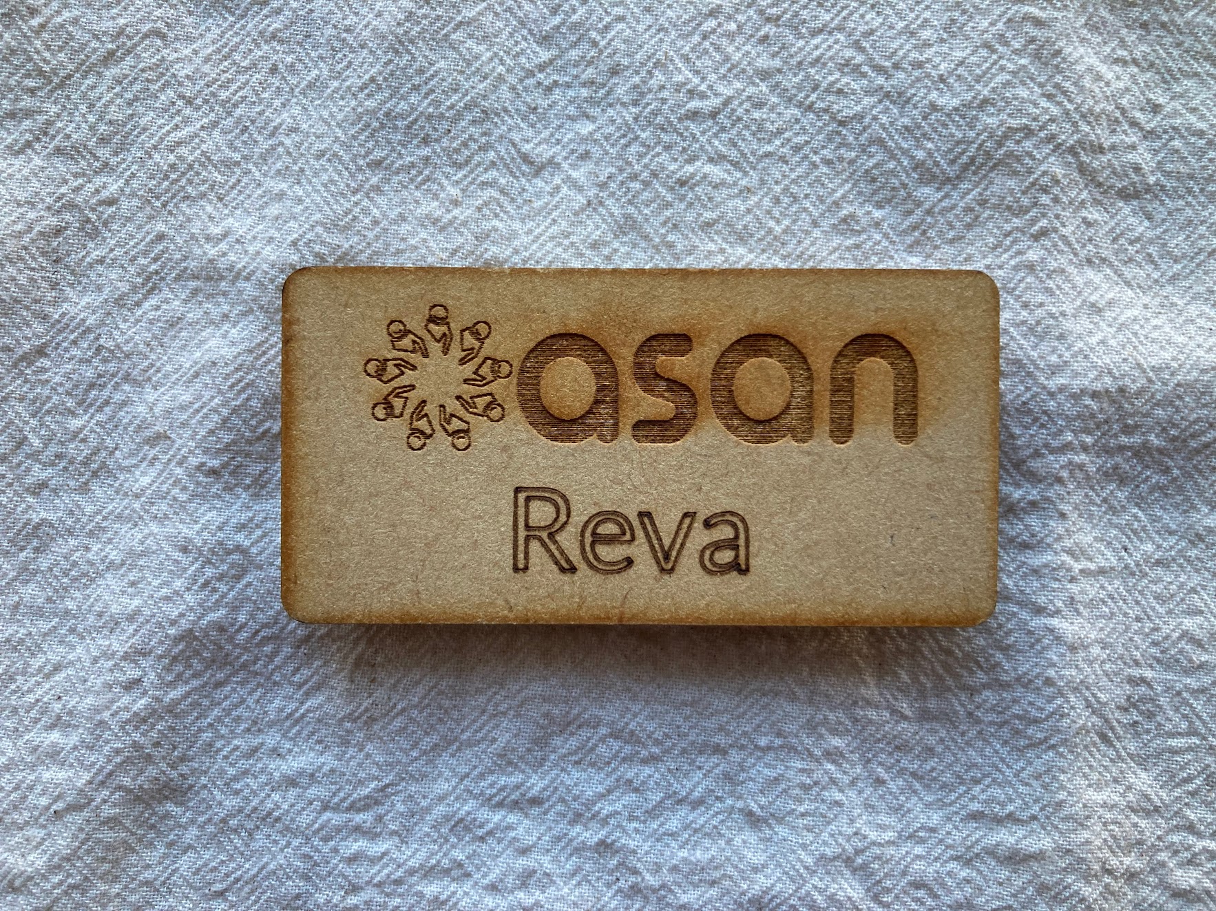 Tall slender porcelain bottle with natural clay textured body and cork stopper.