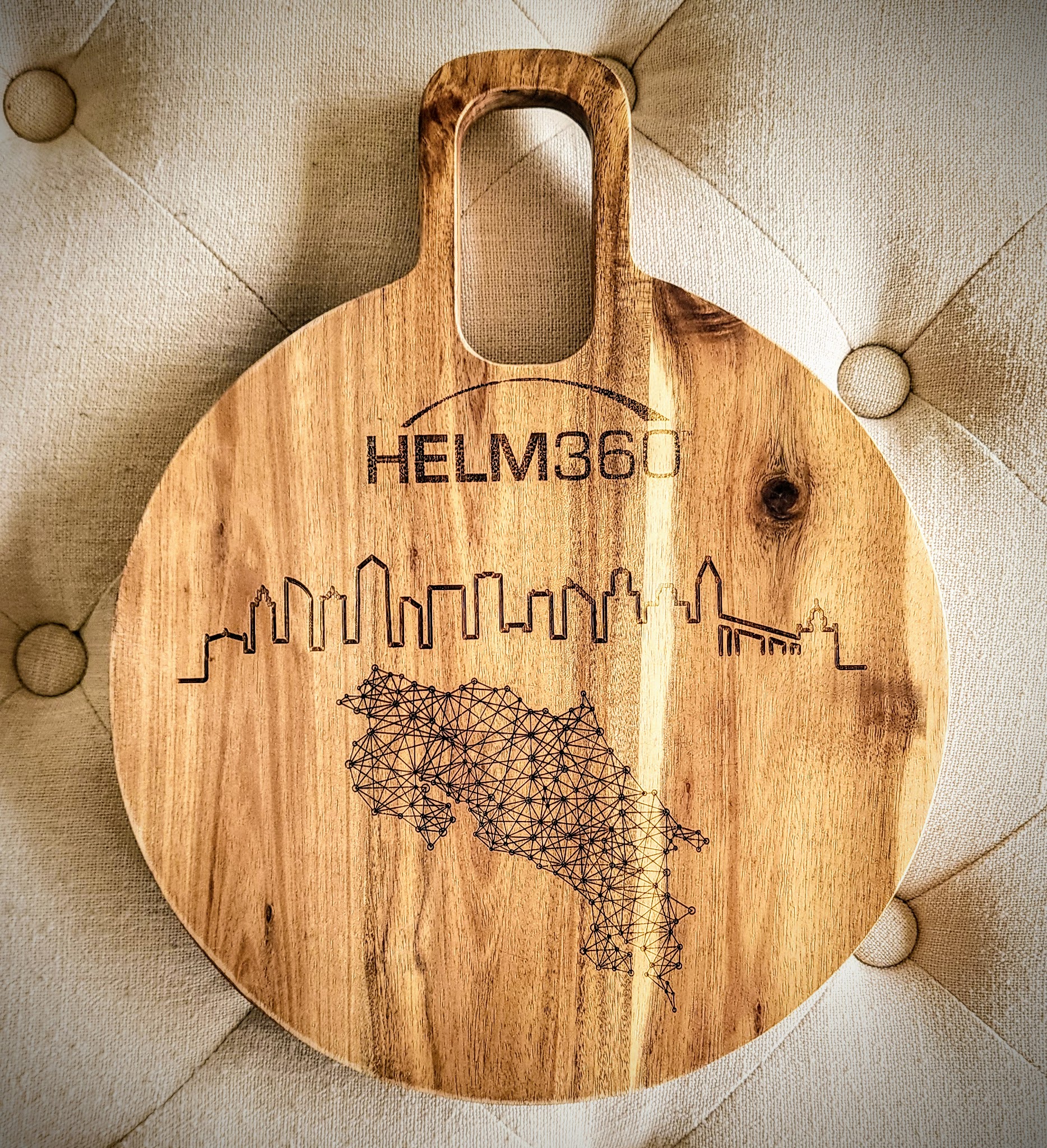 Hand holding black machined steel mechanical pencil with brass tip and top.