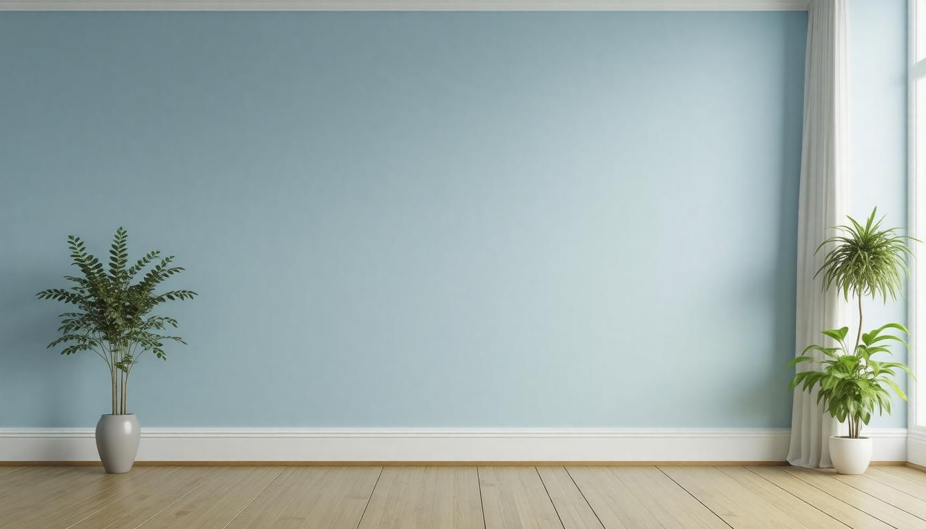 An empty room featuring blue walls and a single potted plant in the corner, creating a calm and serene atmosphere.
