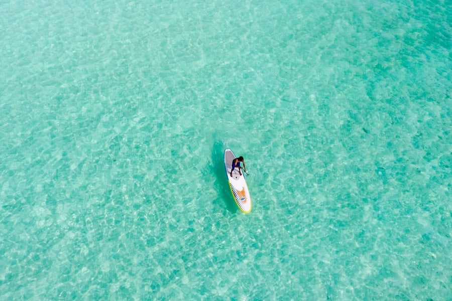 Standup Paddle boarding in Santa Maria from above Cabo Verde islands – best surf spots to surf in Cape Verde on Holiday - Photo by Ishan @seefromthesky | Cape Verde African Caribbean