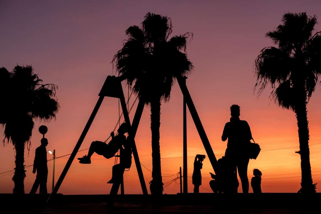 African People in a playground at sunset in Santa Maria Cabo Verde – Cape Verde Weather Guide and holiday Tips - Photo by Gil Ribeiro | Cape Verde African Caribbean