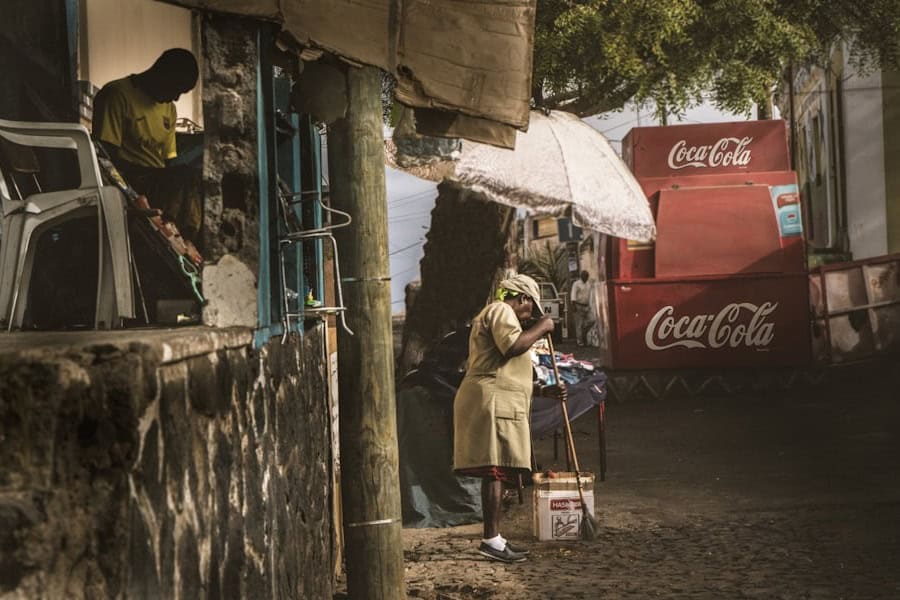 Street scene with African man and woman on Santiago Cabo Verde islands in Praia near the beach – best surf spots to surf in Cape Verde on Holiday - Photo by Danique Tersmette | Cape Verde African Caribbean