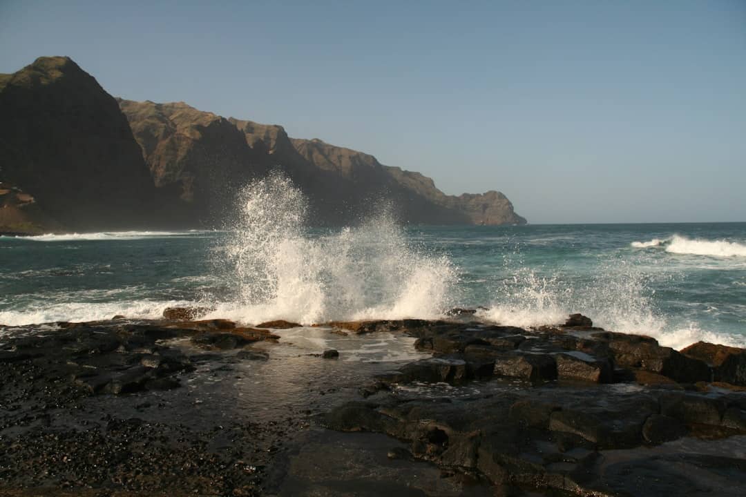 Reef, mountains and waves on Santo Antao Cabo Verde islands – best surf spots to surf in Cape Verde on Holiday - Photo by Dominique Josse | Cape Verde African Caribbean