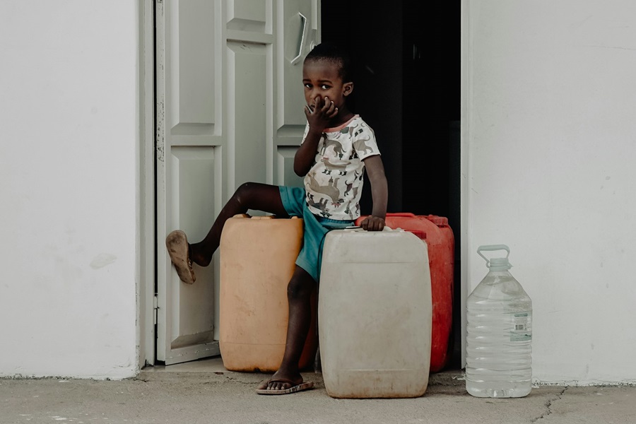 African child with suitcases in Santa Maria Cabo Verde – Where is Cape Verde, Map, Guide and Tips - Photo by Danique Tersmette | Cape Verde African Caribbean
