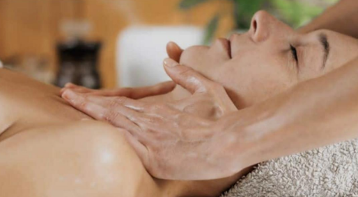 A therapist performing a gentle lymphatic drainage massage on a woman’s neck at ViyUla Beauty Spa in Darwin, designed to reduce swelling and remove toxins.