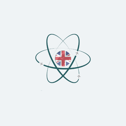 Wood table with porcelain mug, leather journal, brass pen, leather key ring, and a houseplant.