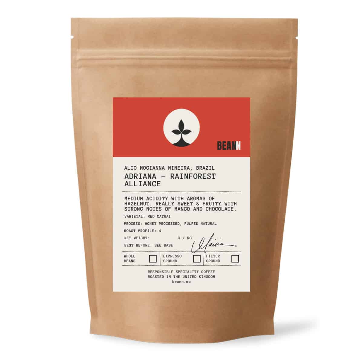 A brown paper bag of Bean brand coffee beans with a white and red product label - beann artisan coffee