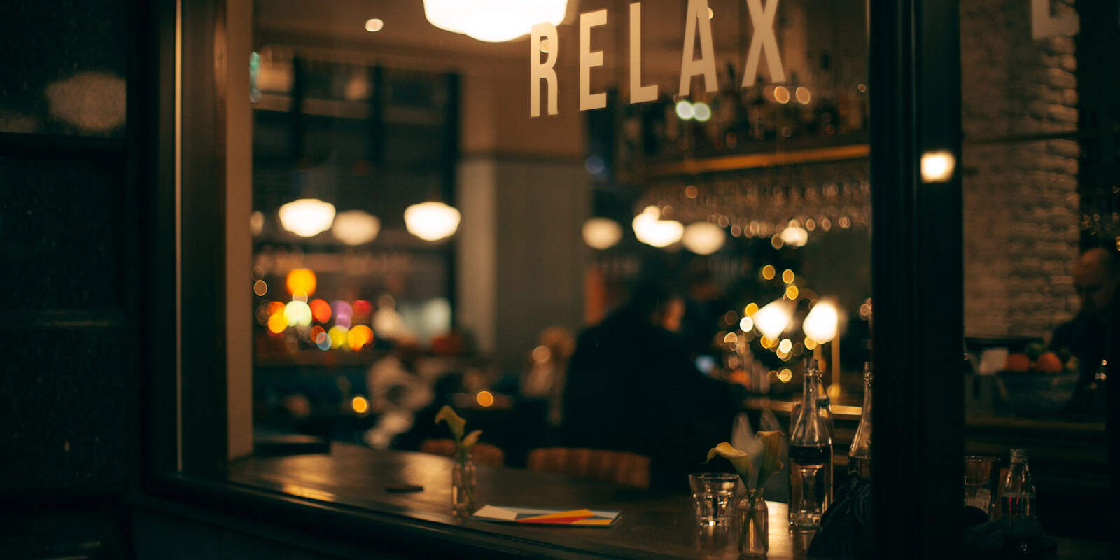  It displays the interior of a coffee shop named "RELAX" - beann artisan coffee